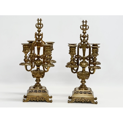 16 - A pair of good quality early 20th century brass candelabrums with pierced bases and draped urn style... 