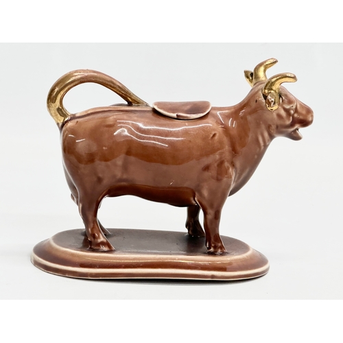 24A - A late 19th century/early 20th century brown pottery Cow Creamer. 16x9x12cm