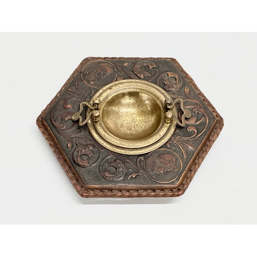 248 - A late 19th century embossed leather bound ashtray with original brass liner. Depicting Don Quixote ... 