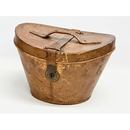 112 - A Victorian top hat with leather hat box. Very Best Manufacture.