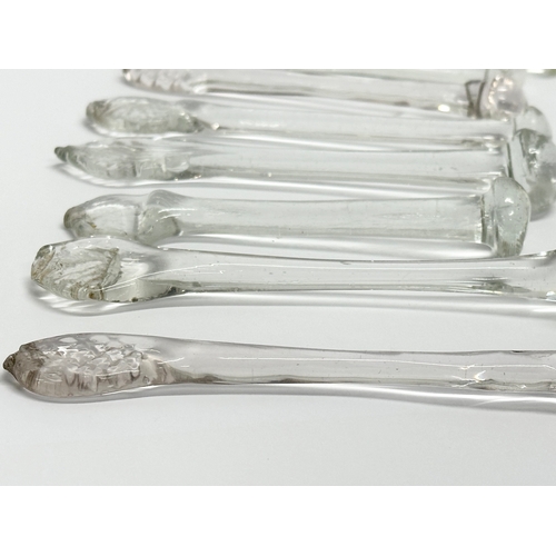 250 - A collection of 8 George III handmade glass sugar crushers. Circa 1800-1820. 13cm