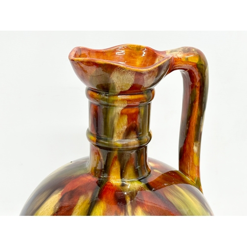 46 - A rare large early 20th century Milton Pottery glazed flagon jug. 24x41cm