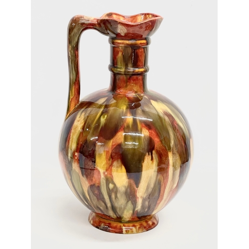 46 - A rare large early 20th century Milton Pottery glazed flagon jug. 24x41cm