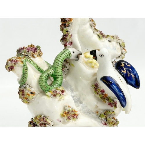 251 - A rare mid 19th century Staffordshire pottery birds nest and snake figure. 12x14.5cm