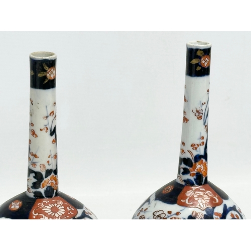 252 - A pair of late 19th century Japanese Meiji period Imari bottle vases. Circa 1880-1890. 20cm