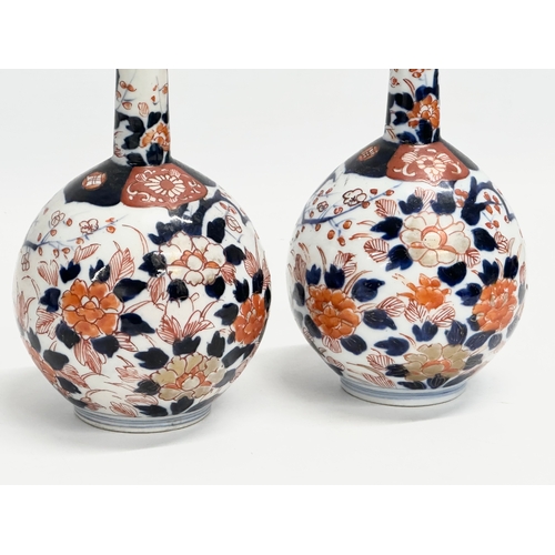 252 - A pair of late 19th century Japanese Meiji period Imari bottle vases. Circa 1880-1890. 20cm