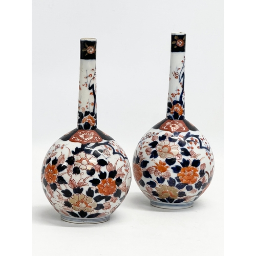 252 - A pair of late 19th century Japanese Meiji period Imari bottle vases. Circa 1880-1890. 20cm