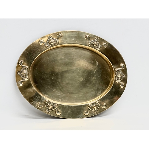 287 - An early 20th century Art Nouveau brass tray. Circa 1900. 31x24cm