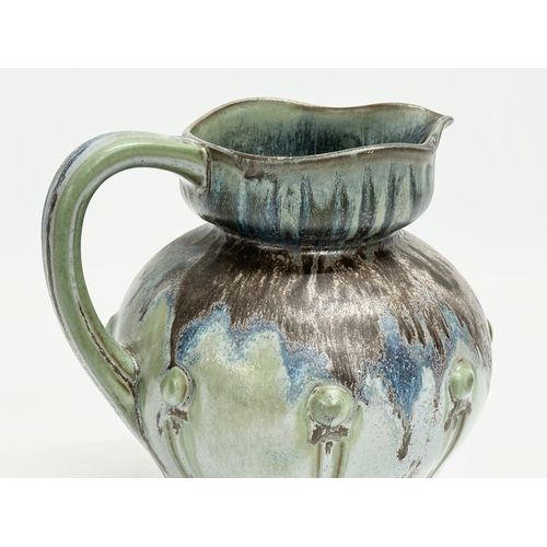 498 - A 1930’s French glazed stoneware jug by Denbac. 17x14x16cm