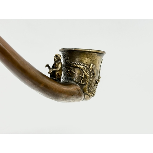 334 - An early 20th century Chinese novelty dragon design opium pipe, with good quality carved monkey and ... 