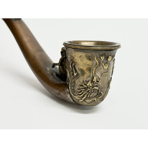 334 - An early 20th century Chinese novelty dragon design opium pipe, with good quality carved monkey and ... 