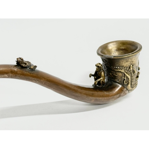 334 - An early 20th century Chinese novelty dragon design opium pipe, with good quality carved monkey and ... 