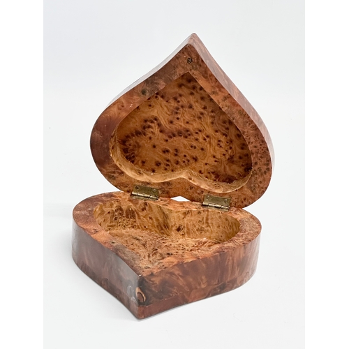 667 - A Burr Walnut heart shaped trinket box. 14x14x6cm