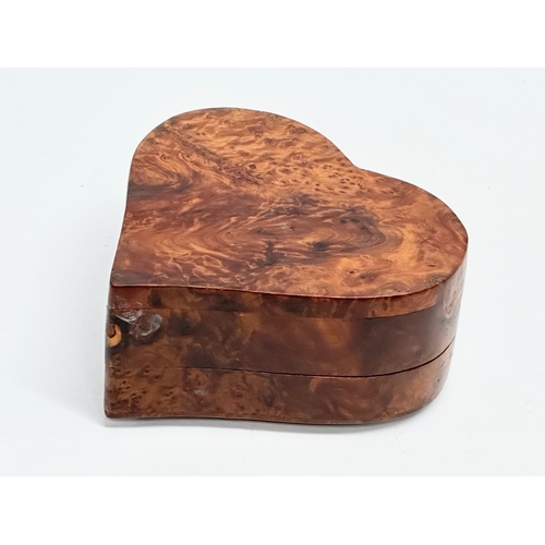 667 - A Burr Walnut heart shaped trinket box. 14x14x6cm