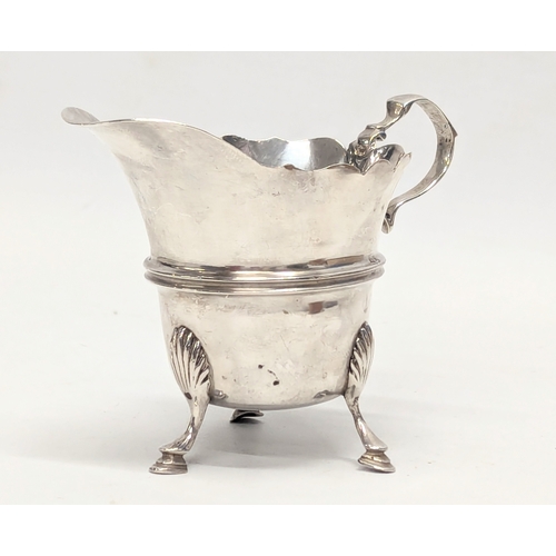 581 - An early 20th century silver cream jug by Sharman D. Neill. Dublin, 1904. 65.4g. 10x7.5cm