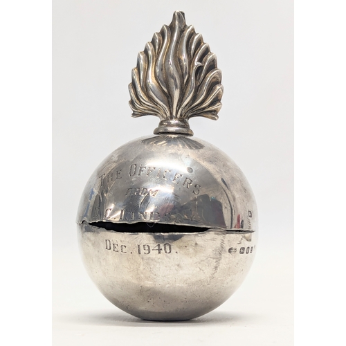 583 - A silver flaming grenade table lighter by Goldsmiths & Silversmiths Co Ltd. London, 1940. Total weig... 