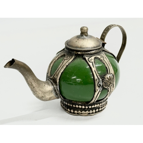 297 - A rare early 20th century Chinese/Tibetan enamelled stoneware teapot. Circa 1900. 15x9.5cm