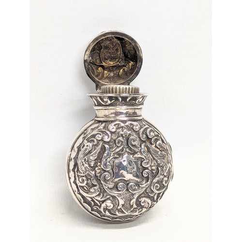 613 - A 19th century silver perfume bottle case with original glass bottle. Birmingham, 1875. Case weighs ... 