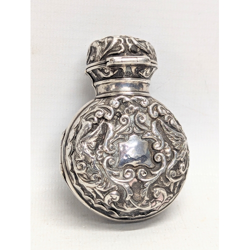 613 - A 19th century silver perfume bottle case with original glass bottle. Birmingham, 1875. Case weighs ... 