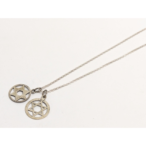 632 - A silver necklace and Star of David pendant. 3.65g