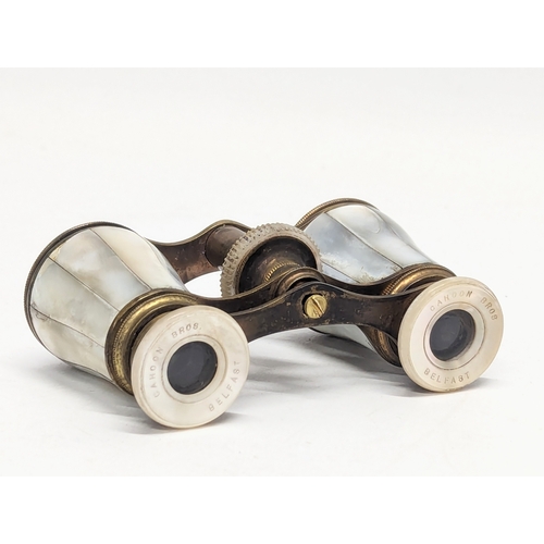 668 - A pair of vintage Mother of Pearl opera glasses by Cahoon Bros, Belfast.