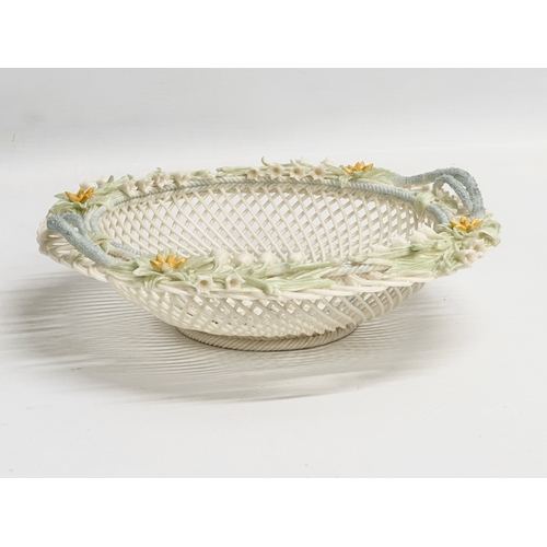 52 - A Belleek Pottery woven basket. 23x23x6cm