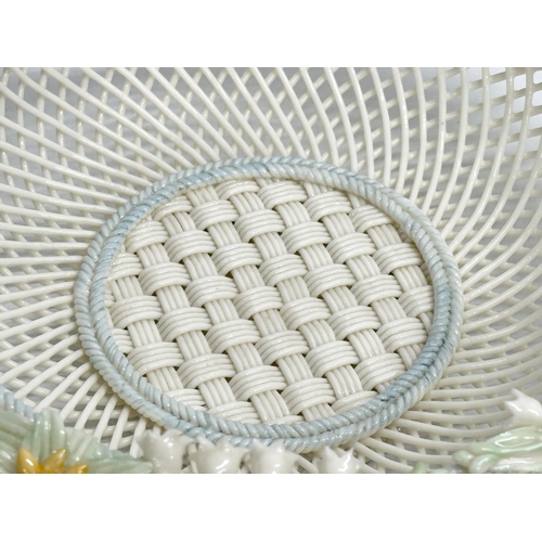 52 - A Belleek Pottery woven basket. 23x23x6cm