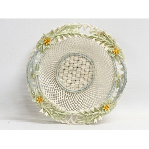 52 - A Belleek Pottery woven basket. 23x23x6cm