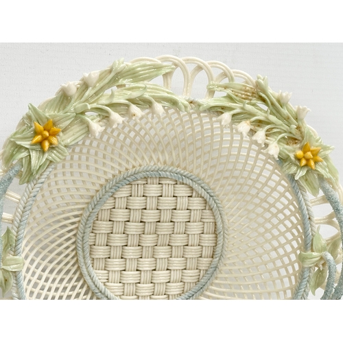 52 - A Belleek Pottery woven basket. 23x23x6cm