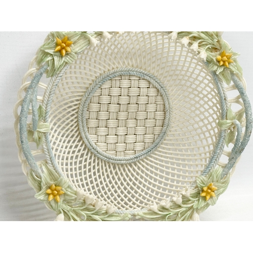 52 - A Belleek Pottery woven basket. 23x23x6cm