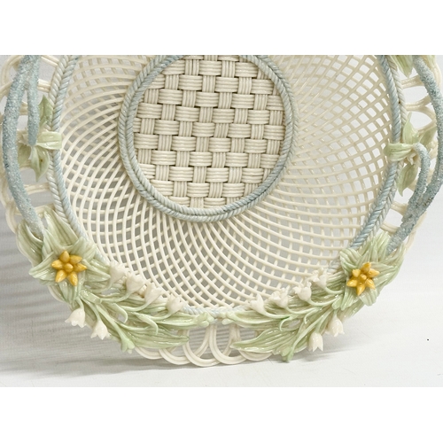 52 - A Belleek Pottery woven basket. 23x23x6cm