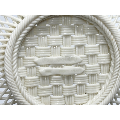 52 - A Belleek Pottery woven basket. 23x23x6cm