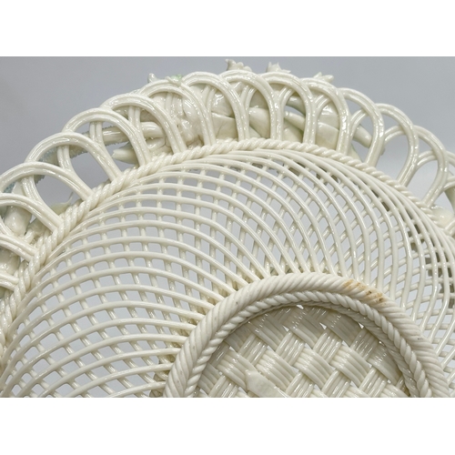 52 - A Belleek Pottery woven basket. 23x23x6cm