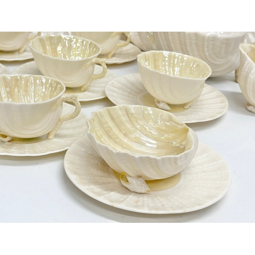 51 - A 23 piece 4th period Belleek pottery ‘Neptune’ seashell tea service. Early/mid 20th century.