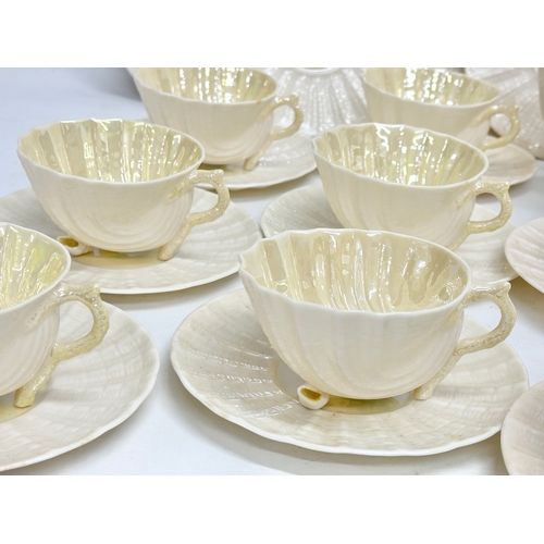 51 - A 23 piece 4th period Belleek pottery ‘Neptune’ seashell tea service. Early/mid 20th century.