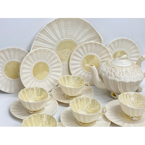 51 - A 23 piece 4th period Belleek pottery ‘Neptune’ seashell tea service. Early/mid 20th century.