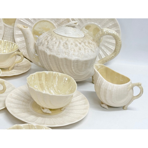 51 - A 23 piece 4th period Belleek pottery ‘Neptune’ seashell tea service. Early/mid 20th century.