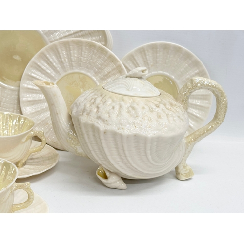 51 - A 23 piece 4th period Belleek pottery ‘Neptune’ seashell tea service. Early/mid 20th century.