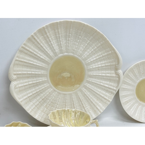 51 - A 23 piece 4th period Belleek pottery ‘Neptune’ seashell tea service. Early/mid 20th century.