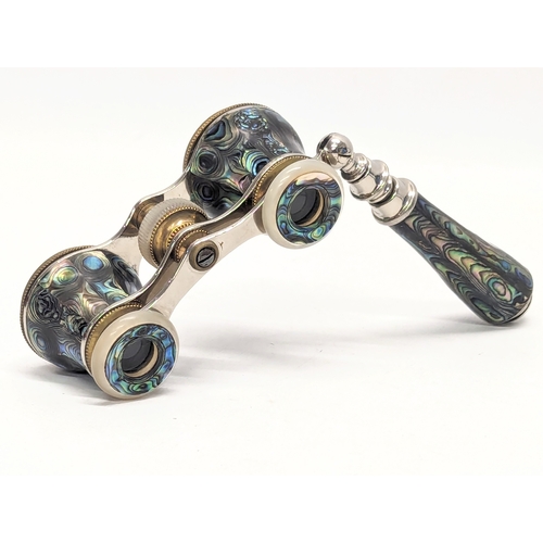 670 - A pair of vintage abalone opera glasses with extending handle in case.