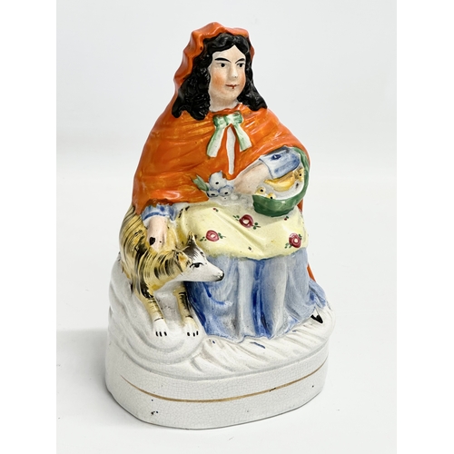 305 - A rare Victorian ‘Little Red Riding Hood’ Staffordshire pottery figure. 12x9x20.5cm