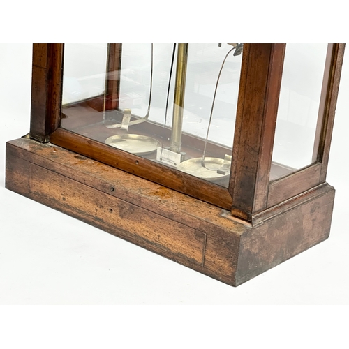 323 - Andrew H. Baird. An early 20th century balance scales case by Andrew H. Baird with Becker’s Sons sca... 