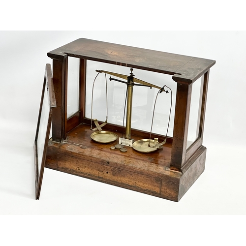 323 - Andrew H. Baird. An early 20th century balance scales case by Andrew H. Baird with Becker’s Sons sca... 