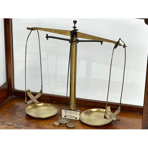 323 - Andrew H. Baird. An early 20th century balance scales case by Andrew H. Baird with Becker’s Sons sca... 