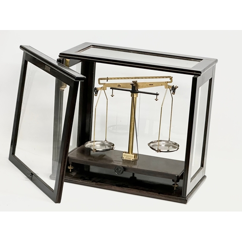 325 - A vintage Griffin & George Limited balance scales in a W.B. Nicolson case. 46x25x41.5cm