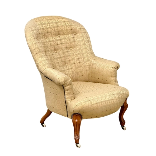 919 - A Victorian walnut buttoned back armchair on Cabriole legs, circa 1870. 66x74x91cm