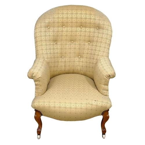 919 - A Victorian walnut buttoned back armchair on Cabriole legs, circa 1870. 66x74x91cm