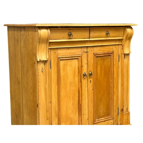 928 - A late 19th century pine side cabinet with 2 drawers and double door cupboard. Circa 1890. 98x51x93c... 