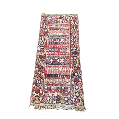 937 - An early 20th century Persian Tabriz hand knotted rug. 74x194cm