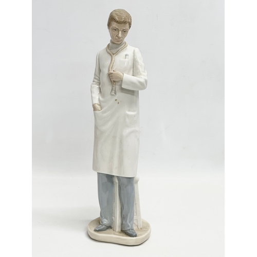 500 - 3 figurines. A Royal Doulton ‘Sweet & Twenty’ figurine 18x12x15cm. A large NAO ‘Doctor’ figurine 35c... 